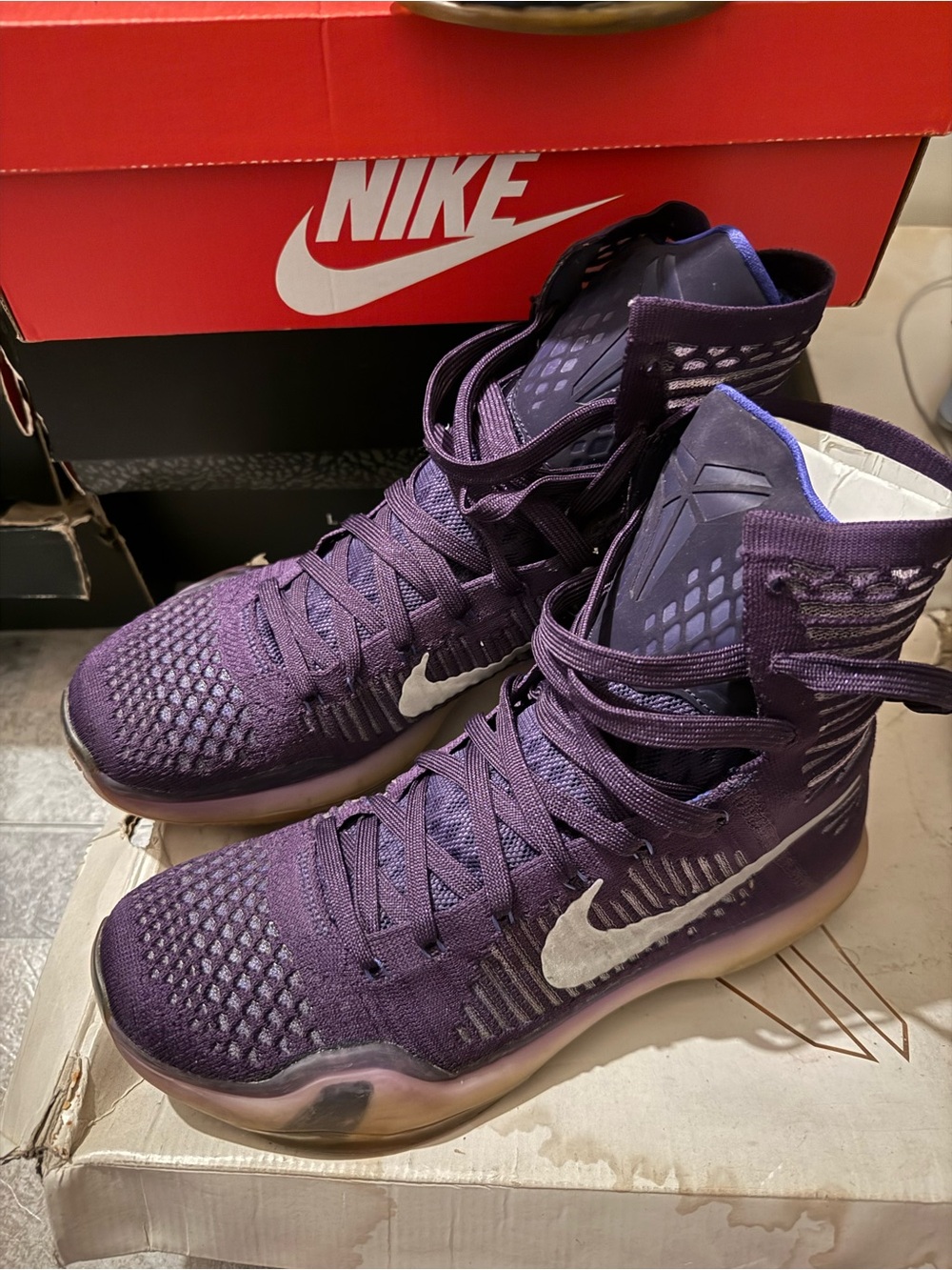 Nike Women’s Purple High-Top Sneakers with White Swoosh